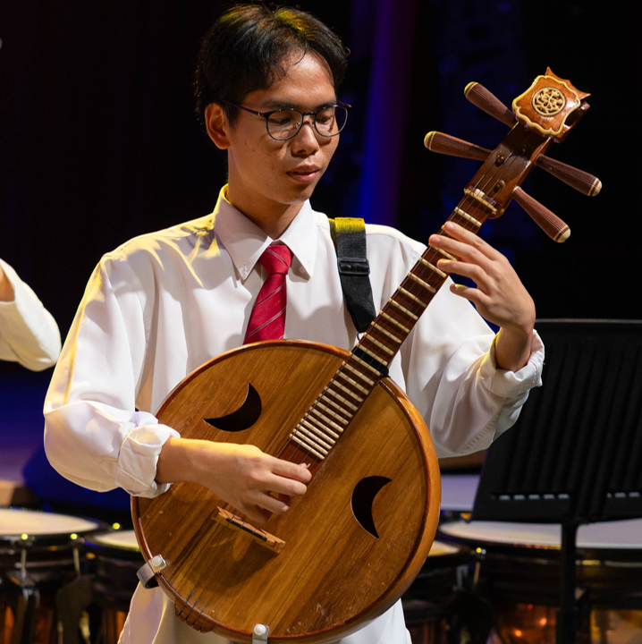 Image of a Chinese Orchestra member performing